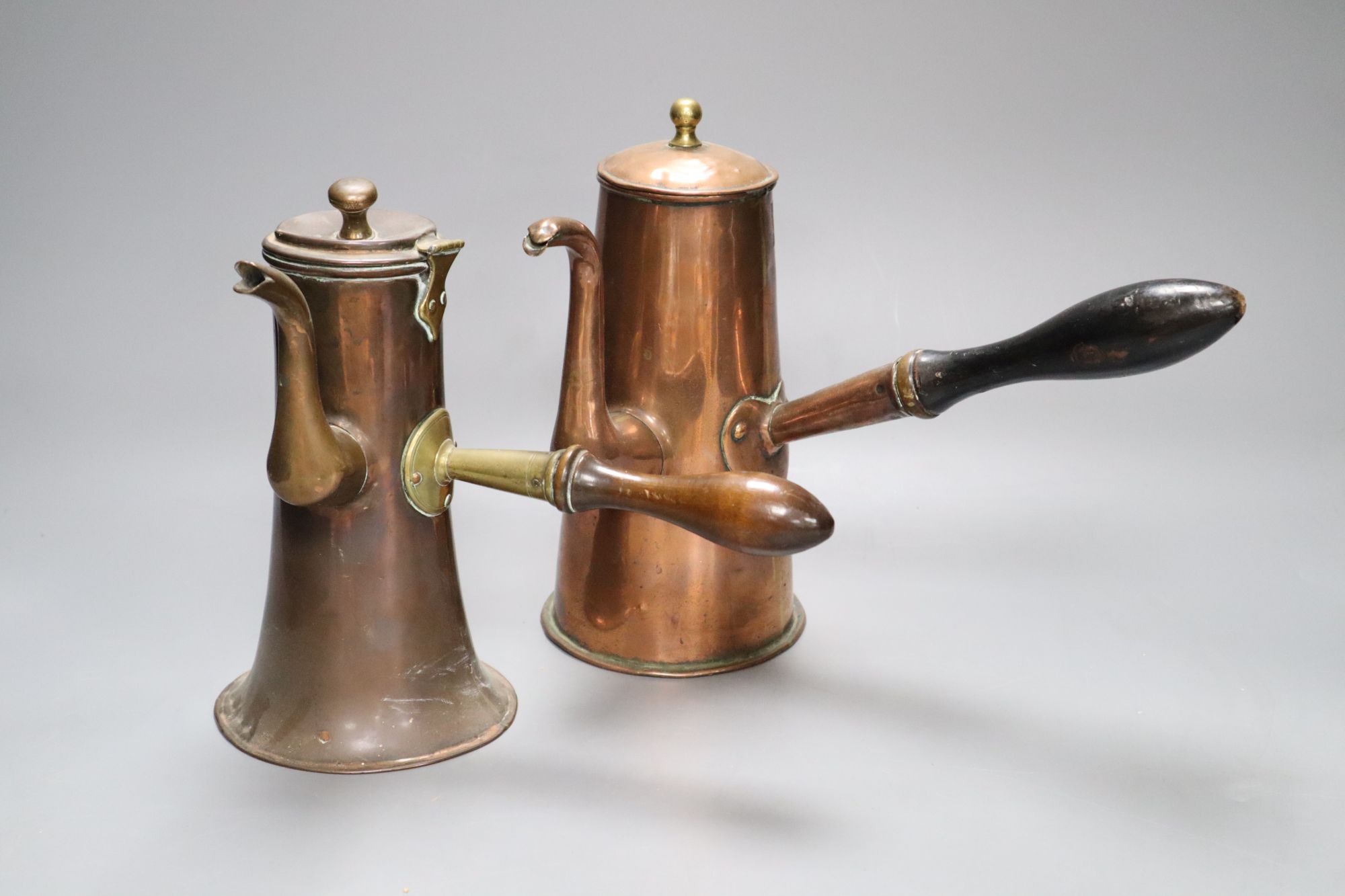 Two 18th century copper Tavern coffee pots, tallest 20cm